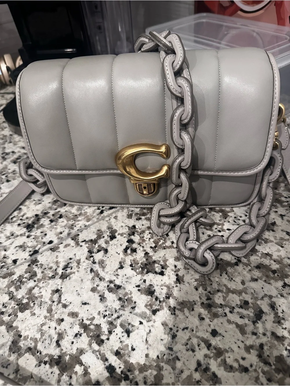 Coach compact quilted